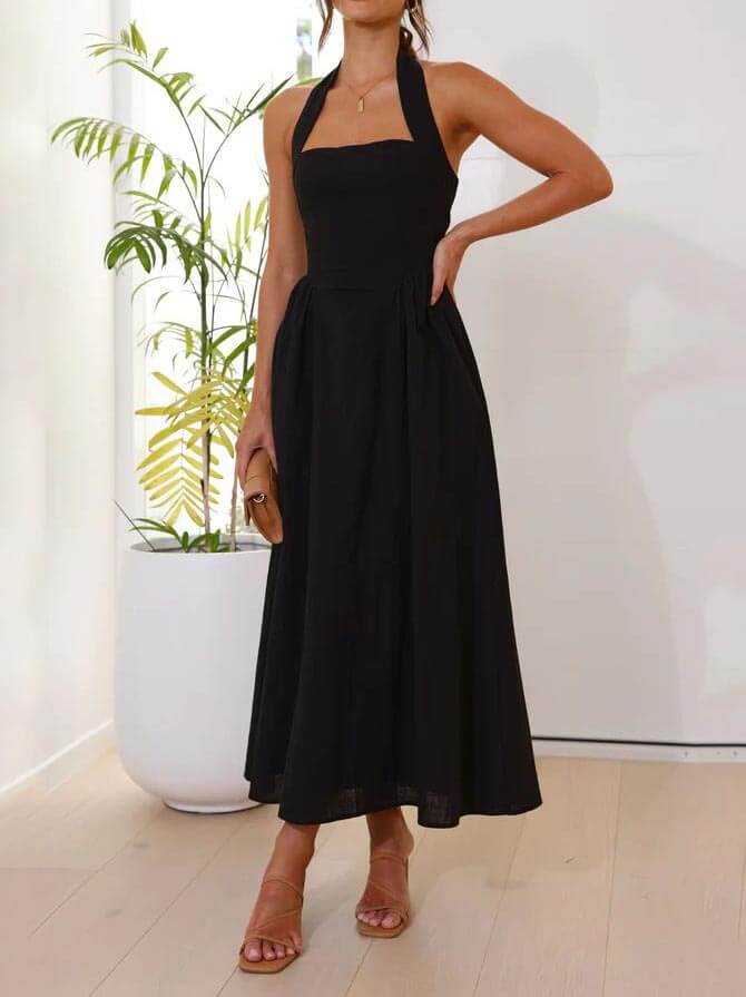 Vestido negro de cuello halter con cintura pequeña y largo medio