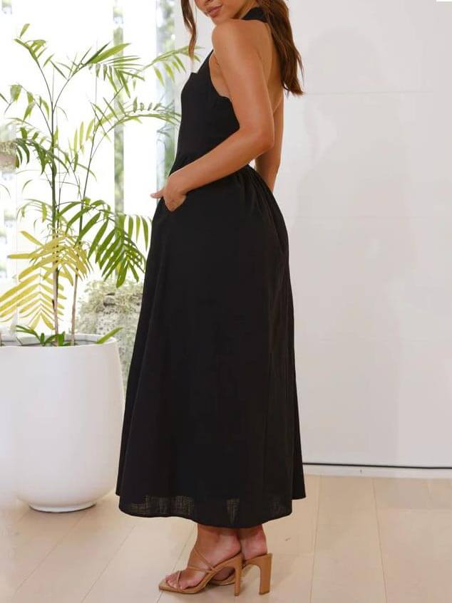 Vestido negro de cuello halter con cintura pequeña y largo medio