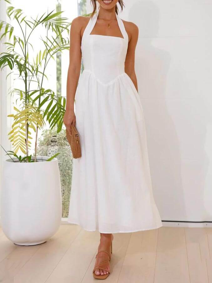 Vestido negro de cuello halter con cintura pequeña y largo medio
