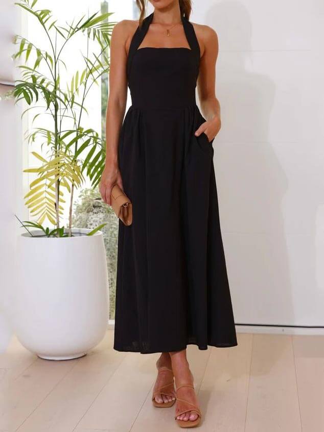 Vestido negro de cuello halter con cintura pequeña y largo medio